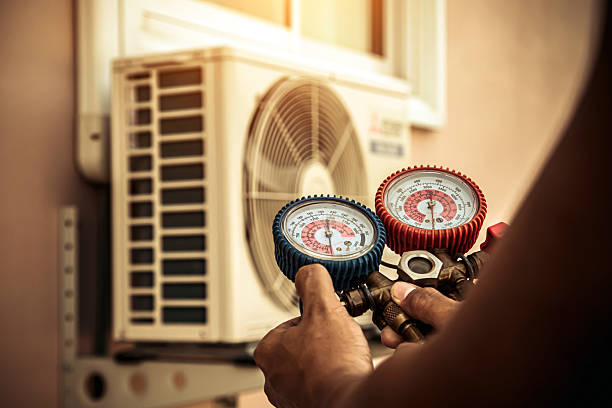 Professional Hvac technician working in Elkmont, AL